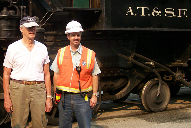 Director/actor Clint Eastwood, left, was on location for filming of The Changeling. Bob Brendza, now general director, Network Control Systems for BNSF, assisted in the operating plan.